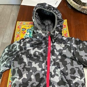 Reversible jacket with fold over mittens